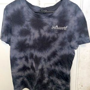 It is a crop top that says introvert on it